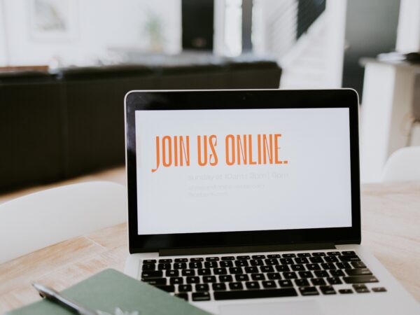 MacBook with the words join online on screen